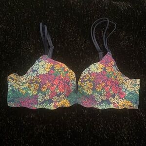 Super cute flower, multicolor print push-up bra. Straps are navy and adjustable.